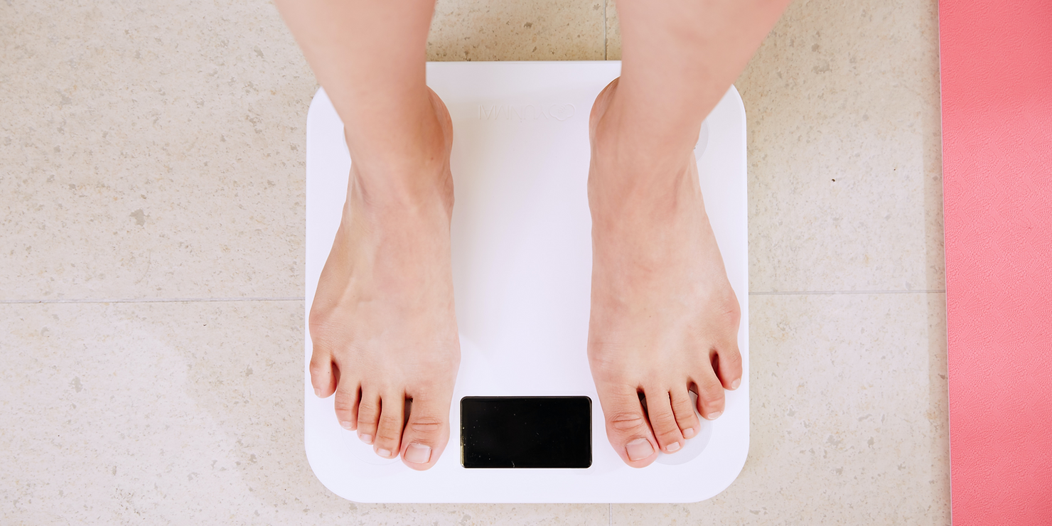 girl measuring weight