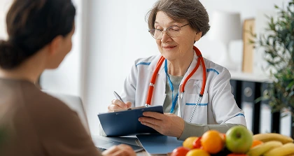 Doctor writing diet notes
