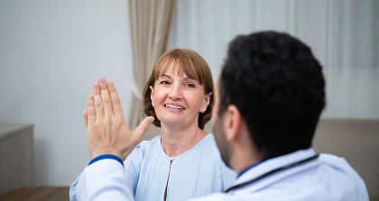 Patient high-fiving doctor