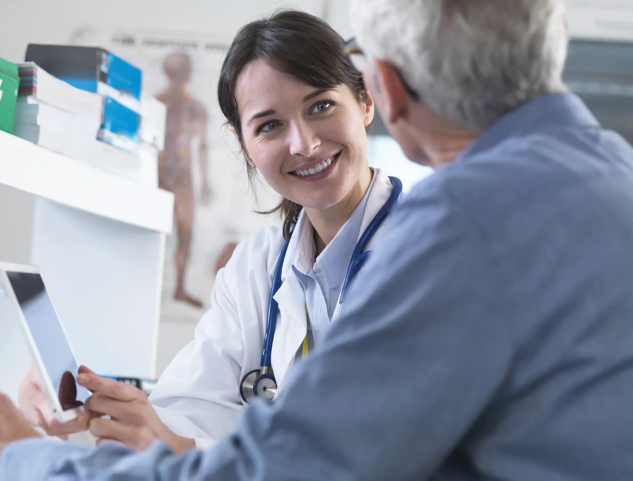 doctor sharing health information on digital table scaled